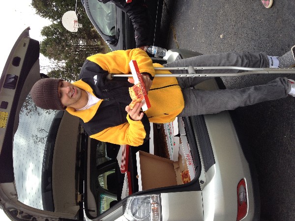 Dan Shaer, chapter vice president for Young AFCEANs, enjoys a slice of pizza in November after leading the team to build a shed in support of STEM activities at Fort Belvoir Elementary School.